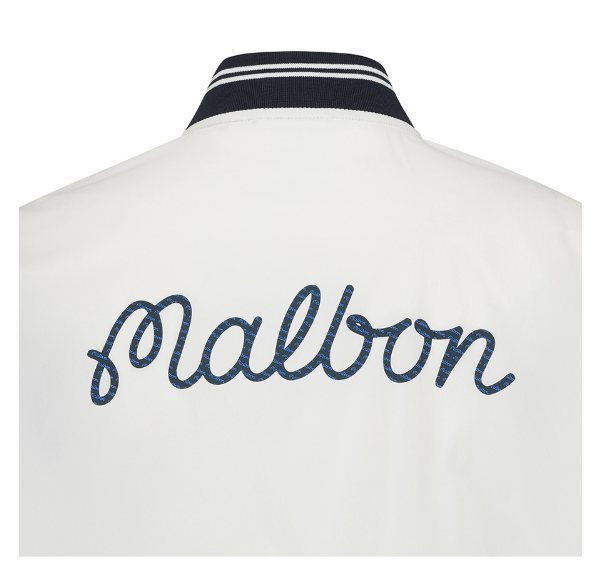 Malbon women's stand collar lightweight breathable golf jacket in Navy Blue, branding detail