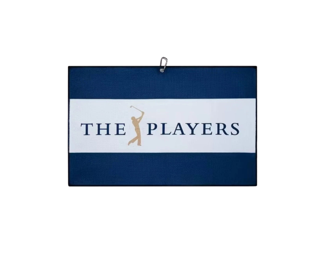 Malbon Blue Microfiber Golf Towel — clipped to a golf bag