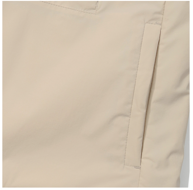 Malbon women's lightweight cargo windproof golf vest in Beige, branding detail