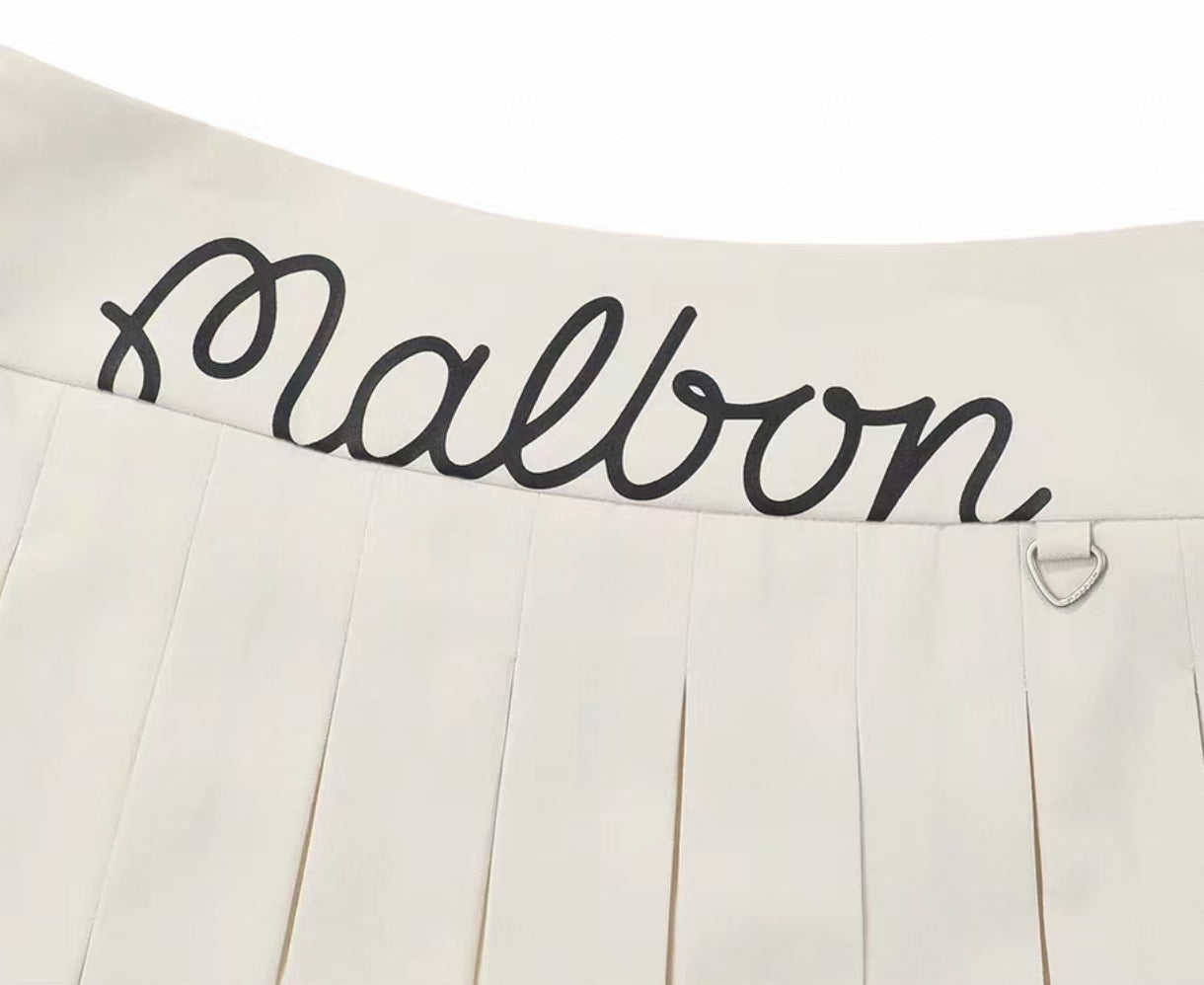 Malbon Women's Logo Pleated Golf Skort Beige pleated golf skort front view