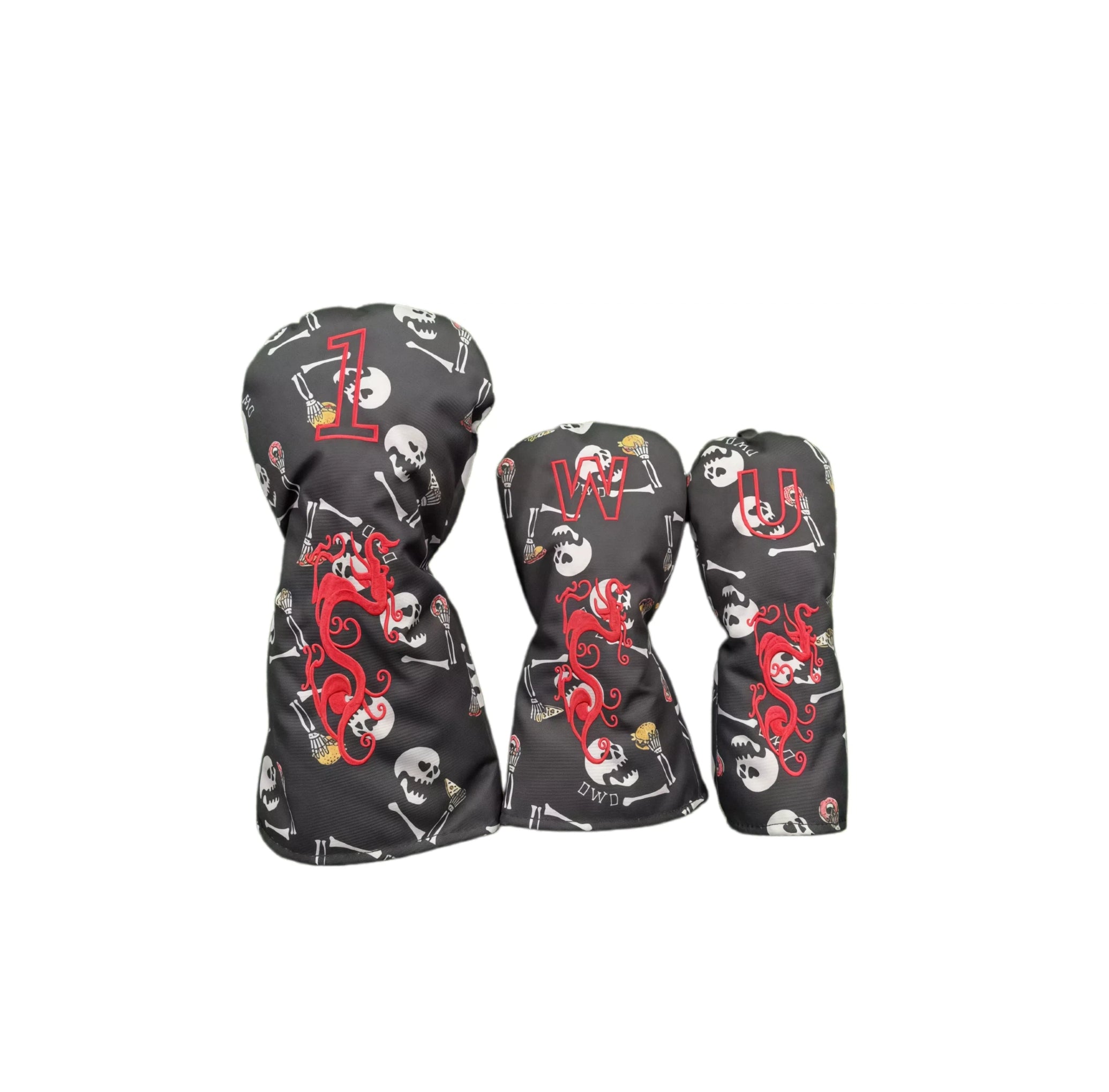 Graffiti flocked golf headcovers set in black featuring red dragon embroidery and white skull bone patterns, labeled with “1”, “W”, “U” for driver, fairway and utility clubs.