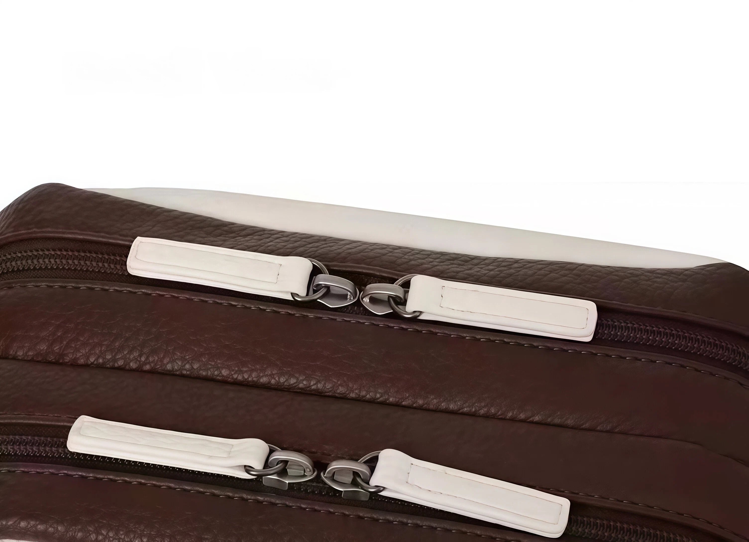 Detail shot of the Malbon clutch’s dual zippers with white leather pull tabs and silver hardware. Premium construction ensures smooth operation and long-lasting durability.