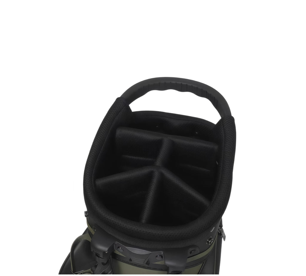 Interior of Malbon golf stand bag featuring black padded lining, segmented club dividers, and ergonomic design for secure golf club storage.