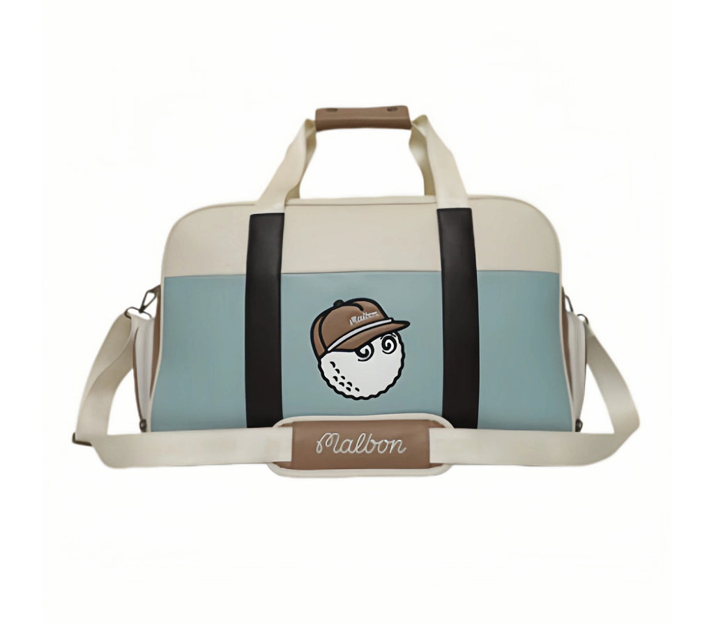 Front view of Malbon Golf Boston bag in light blue and cream PU leather, featuring cartoon golf ball wearing cap, dual top handles, and adjustable shoulder strap