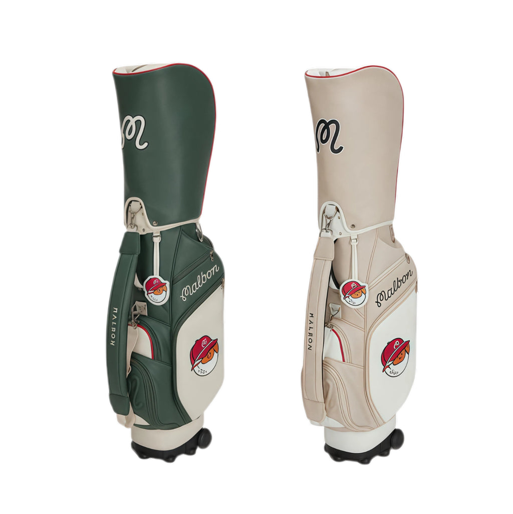 Side-by-side view of Malbon Golf cart bags in green and beige colors. Both feature dual-tone design, red trim, mascot patch, and built-in wheels for easy transport on the course.