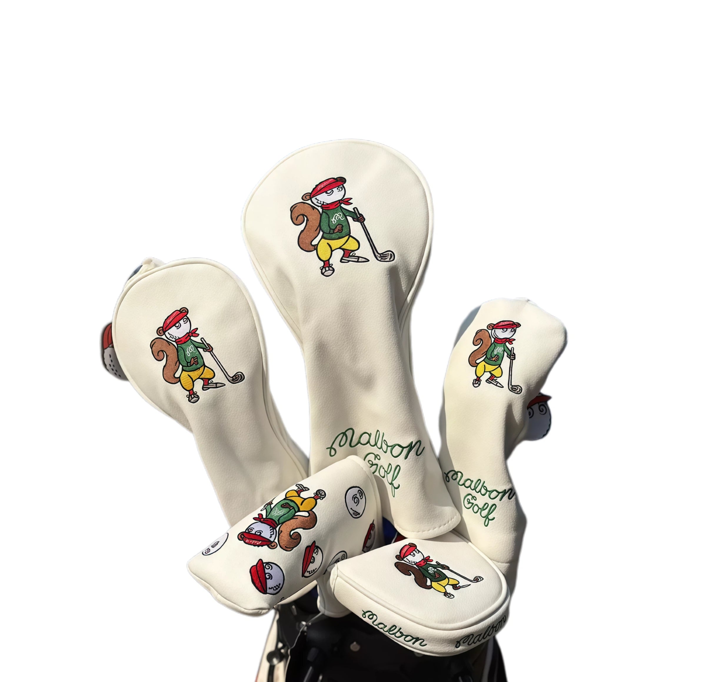 Close-up of Malbon Golf’s beige squirrel headcovers featuring animated golf-playing squirrels and elegant green embroidery — ideal for driver, fairway, hybrid, and putter clubs with waterproof PU fabric and magnetic closure.