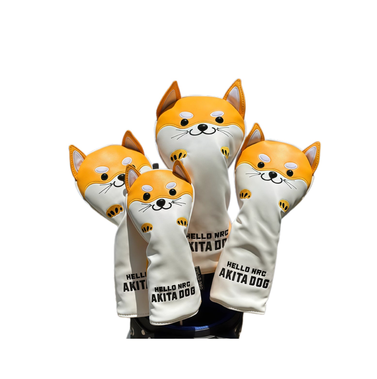 Side view of an orange Akita Inu golf headcover set displayed on a golf bag, showing the full design including ears, paws, and tail — durable waterproof material protects driver, fairway, and hybrid clubs with playful charm.