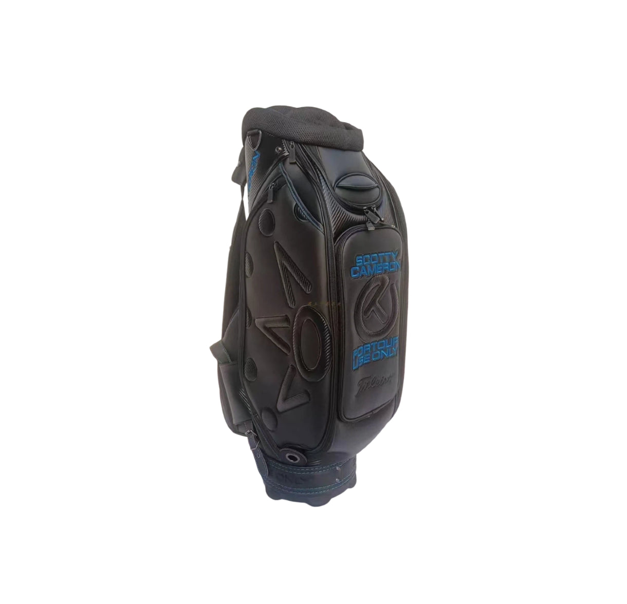 Close-up of the ball pocket on the Scotty Cameron Backin Black Staff Bag, featuring "SCOTTY CAMERON" and "FOR TOUR USE ONLY" embroidery in blue with the Titleist logo below.