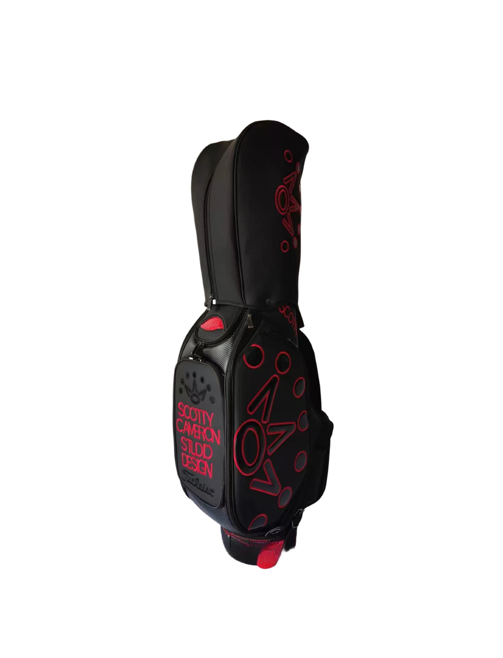 Front view of the Scotty Cameron Supercar Staff Bag showcasing the accessory pocket with "SCOTTY CAMERON STUDIO DESIGN" text, the red "NOV" crown graphic, and the Titleist logo at the bottom.