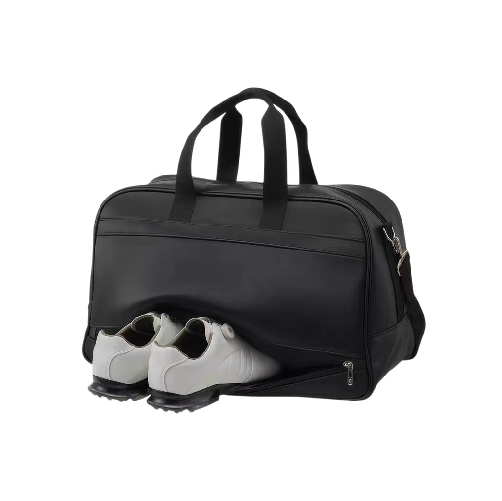 Close-up of the TaylorMade Auth-Tech Boston bag showing the open shoe compartment with a pair of white golf shoes inside. Designed with a dedicated ventilated shoe pocket to keep footwear separate and odor-free during transport.