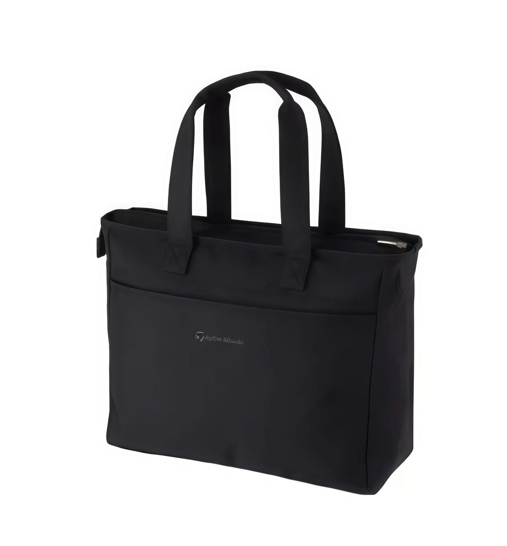 Back view of the TaylorMade Black Golf Tote showing a small, elegant embroidered "TaylorMade" script logo. Designed for clean, minimalist style and everyday use.