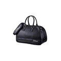 Black Titleist duffel bag with glossy carbon fiber texture, dual handles, and embroidered logo. Ideal for golf and travel.