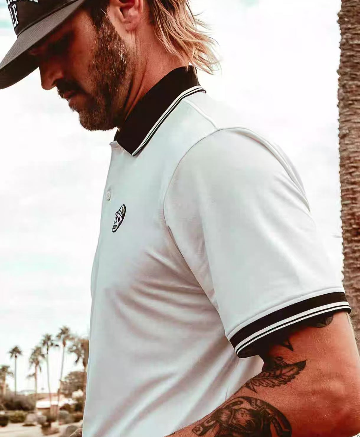 Devereux men’s White letter-print golf polo side model view
