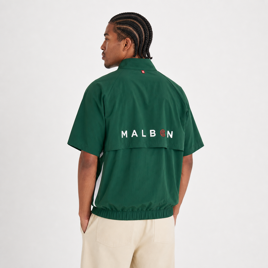 Malbon CLOT green golf windshirt branding detail